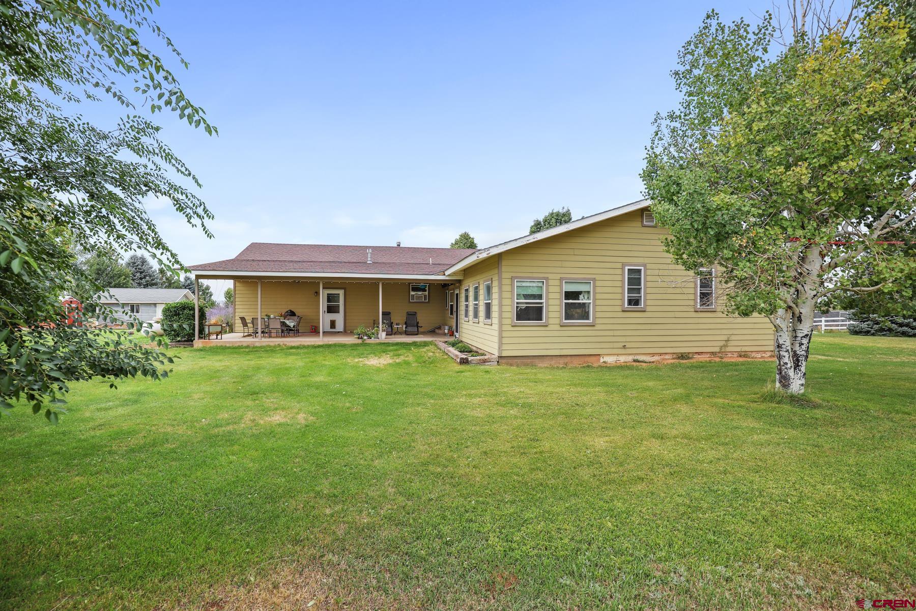 25548 Rd N 6 Loop Cortez, CO 81321 - Photo 7 of 35 a front view of a house with a garden