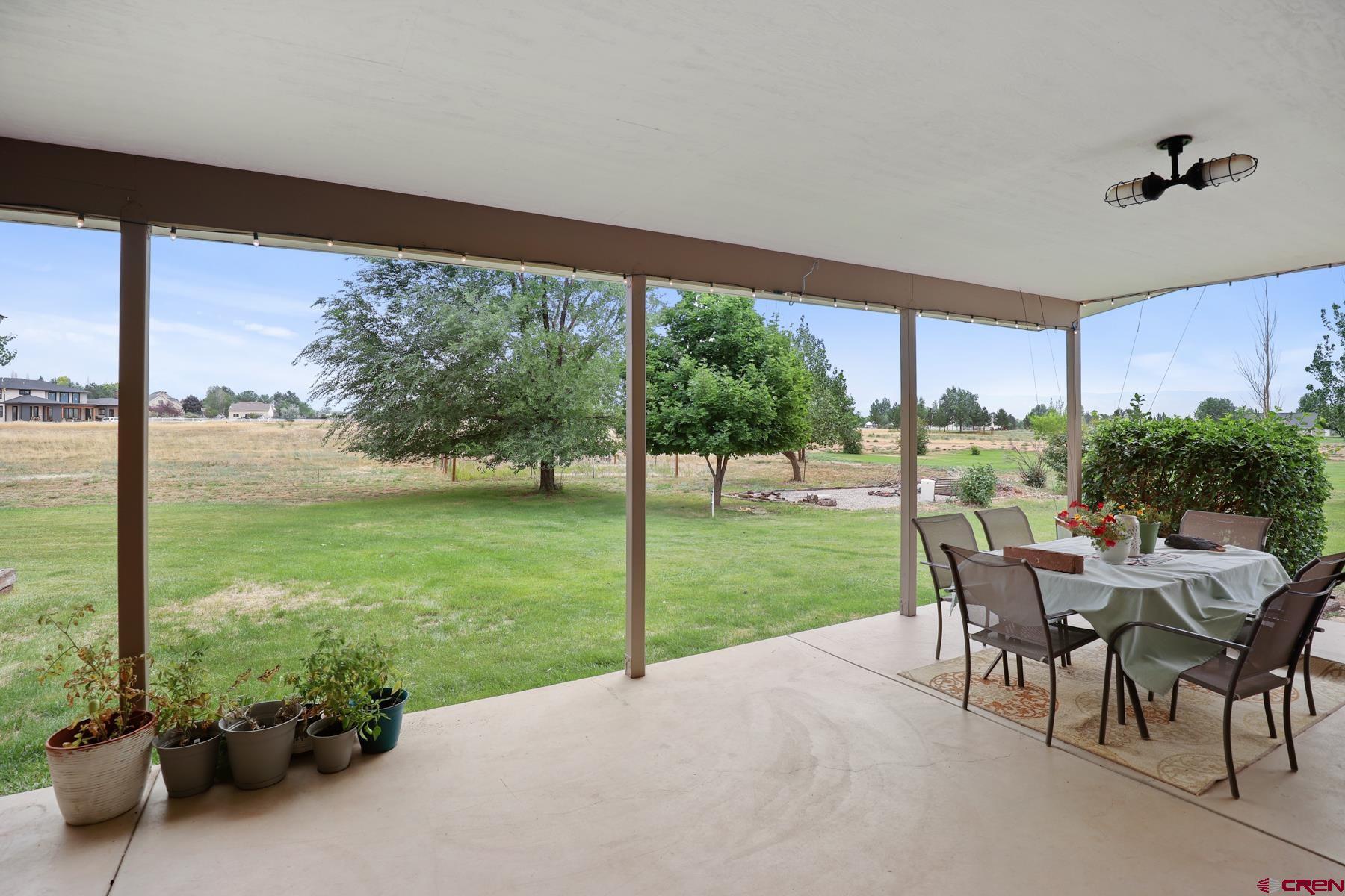 25548 Rd N 6 Loop Cortez, CO 81321 - Photo 10 of 35 a view of a porch with furniture and garden