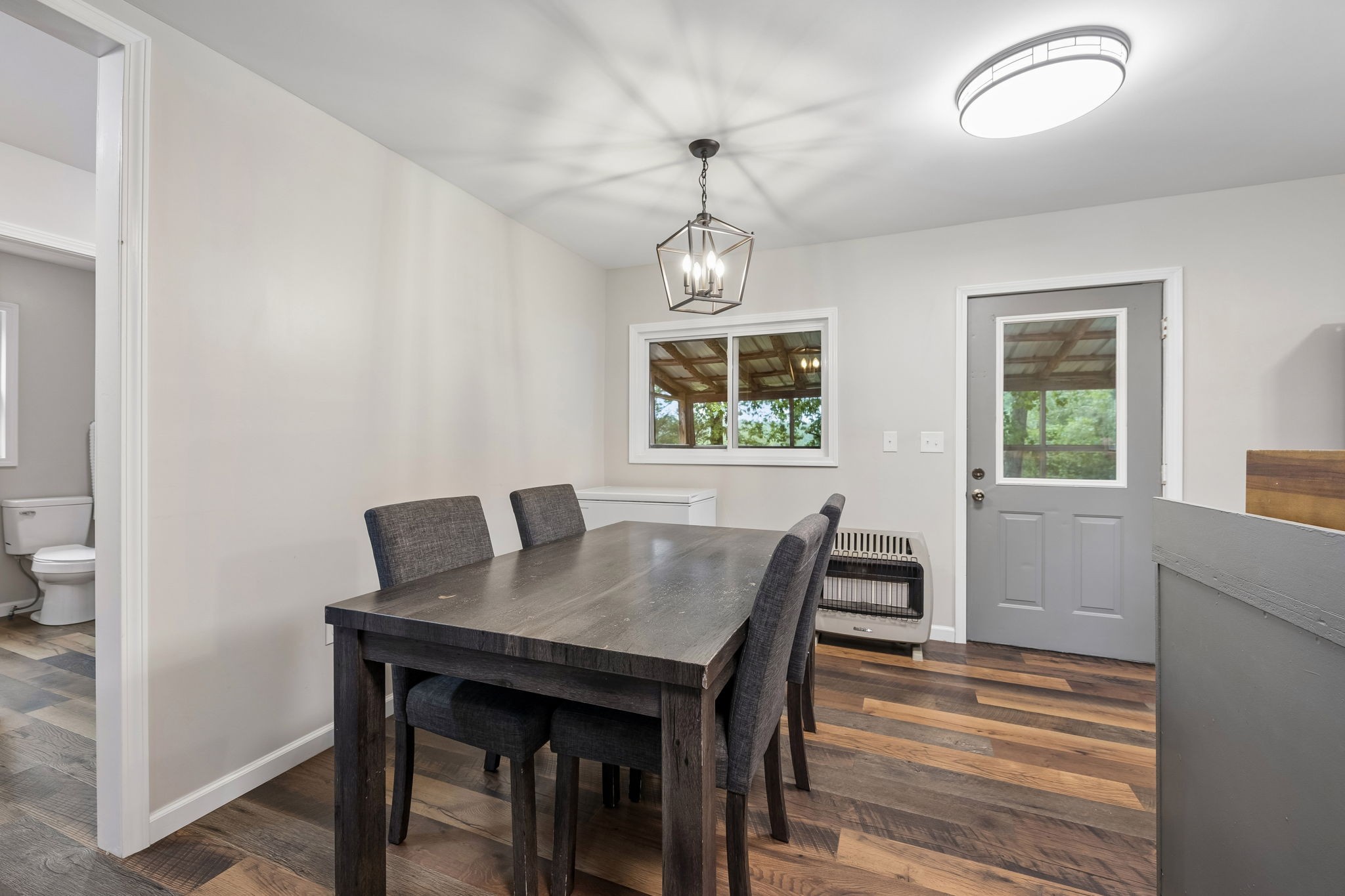 121 Hannah Road Summertown, TN 38483 - Photo 19 of 52 a view of a dining room with furniture window and wooden floor
