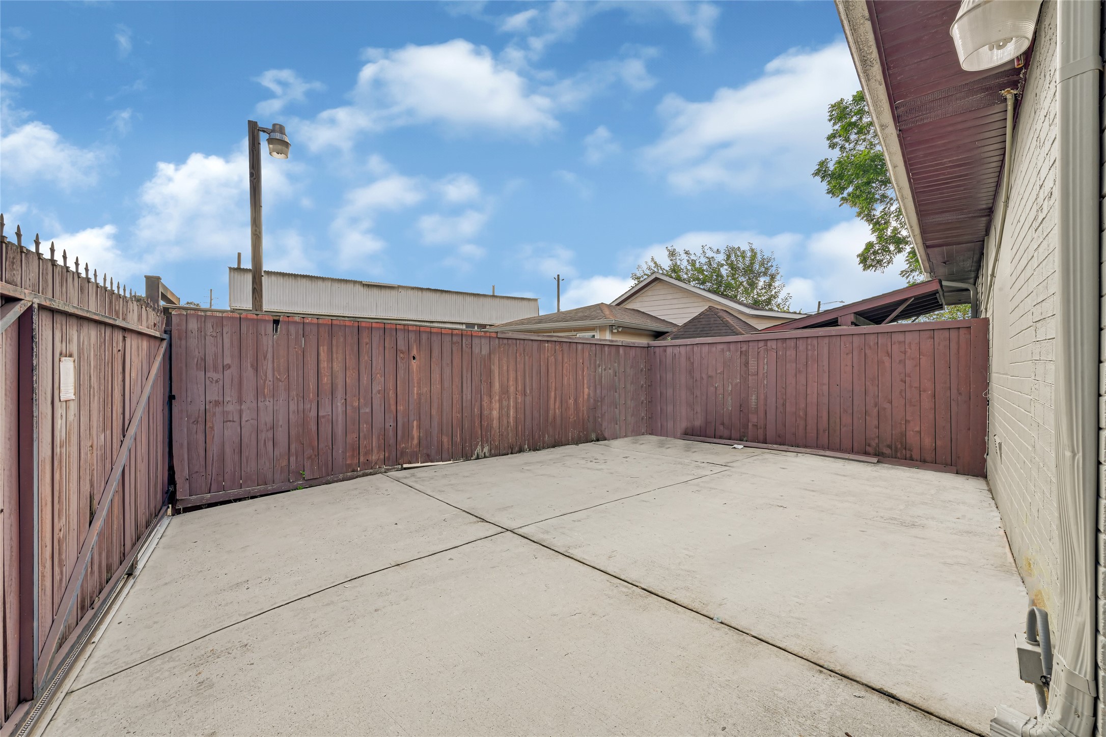 2809 Tooke Street Houston, TX 77023 - Photo 11 of 50 a view of backyard with barbeque and wooden fence