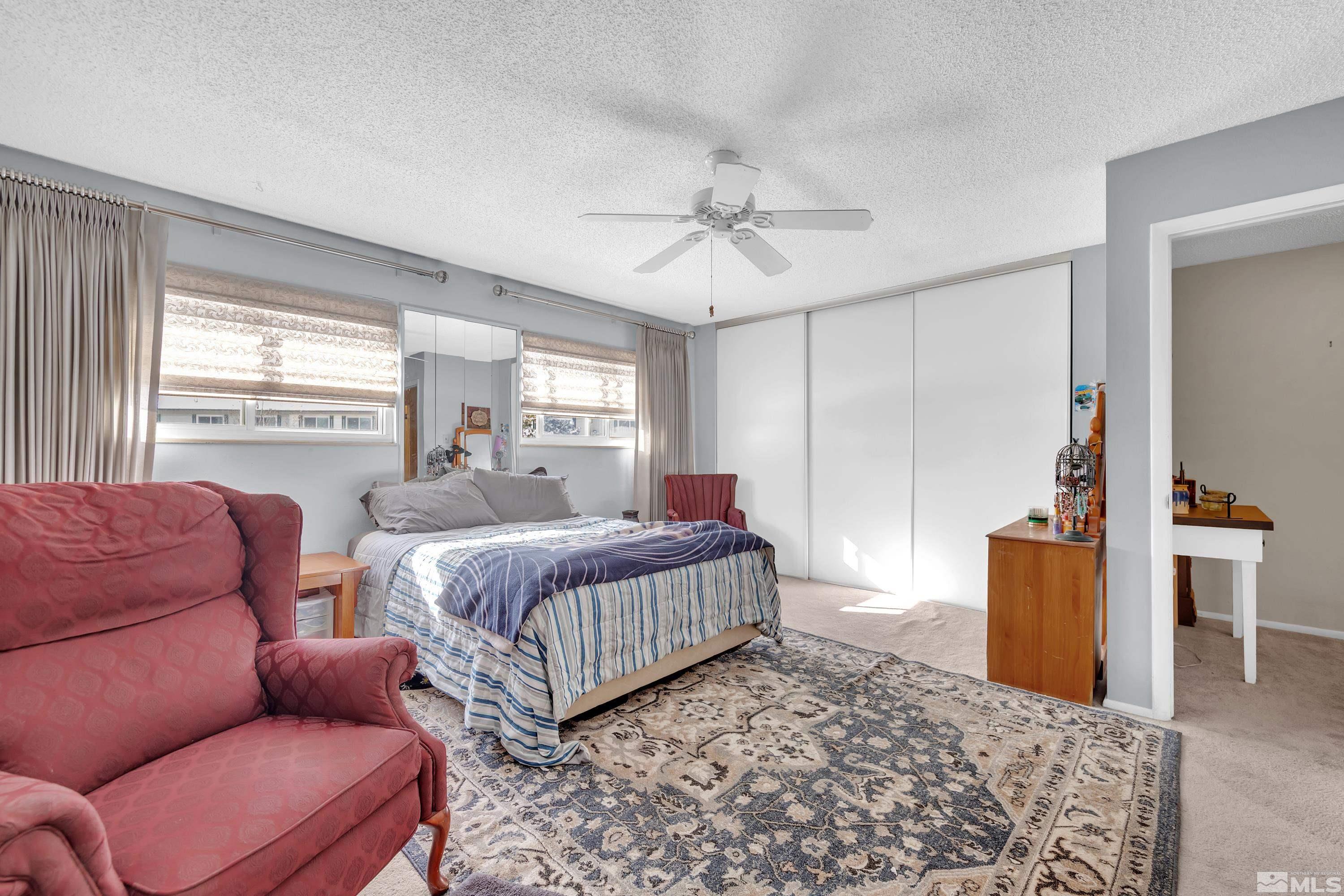 335 Smithridge Park Reno, NV 89502 - Photo 15 of 30 a bedroom with bed and wooden floor
