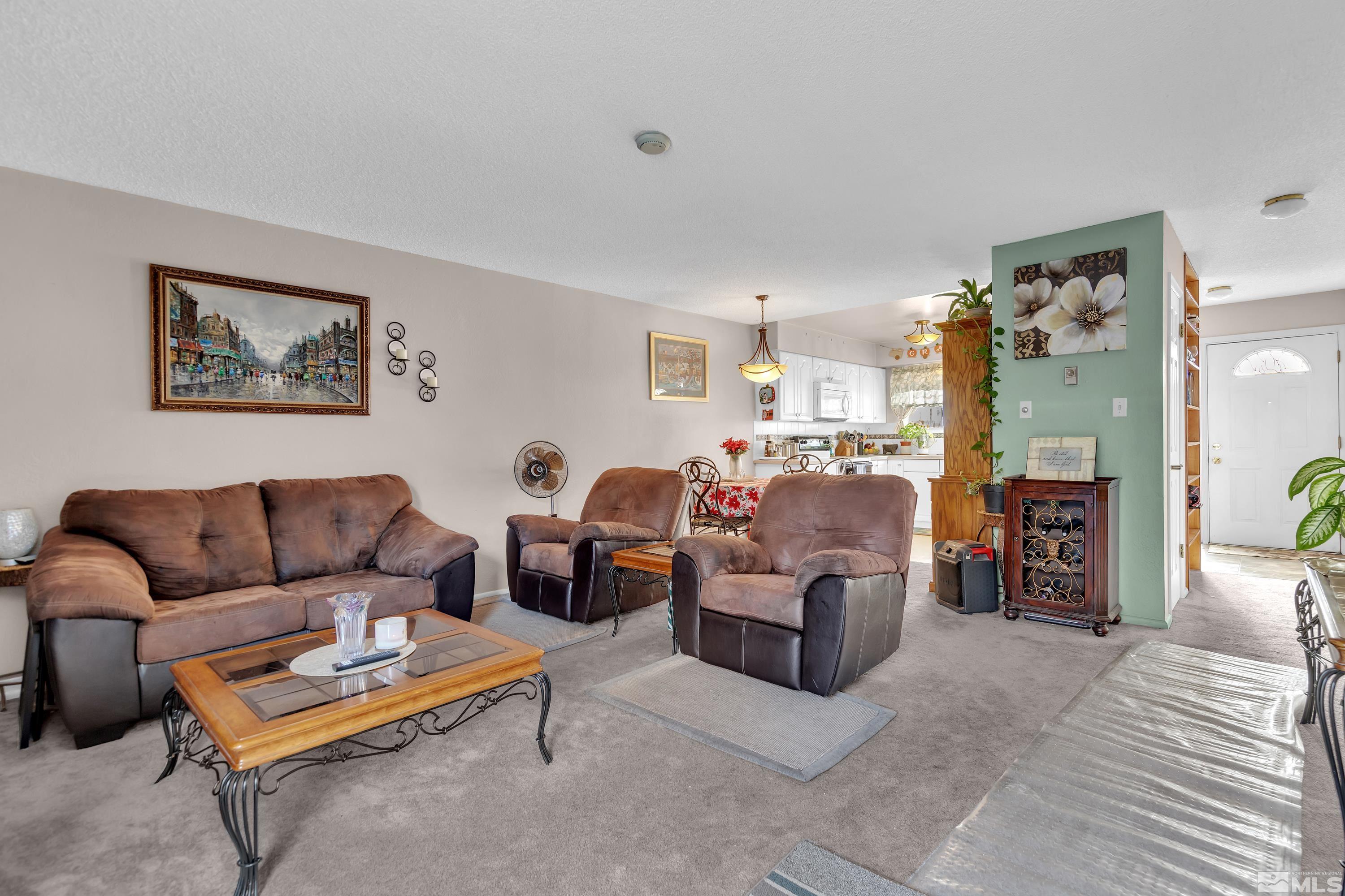335 Smithridge Park Reno, NV 89502 - Photo 4 of 30 a living room with furniture kitchen view and a table