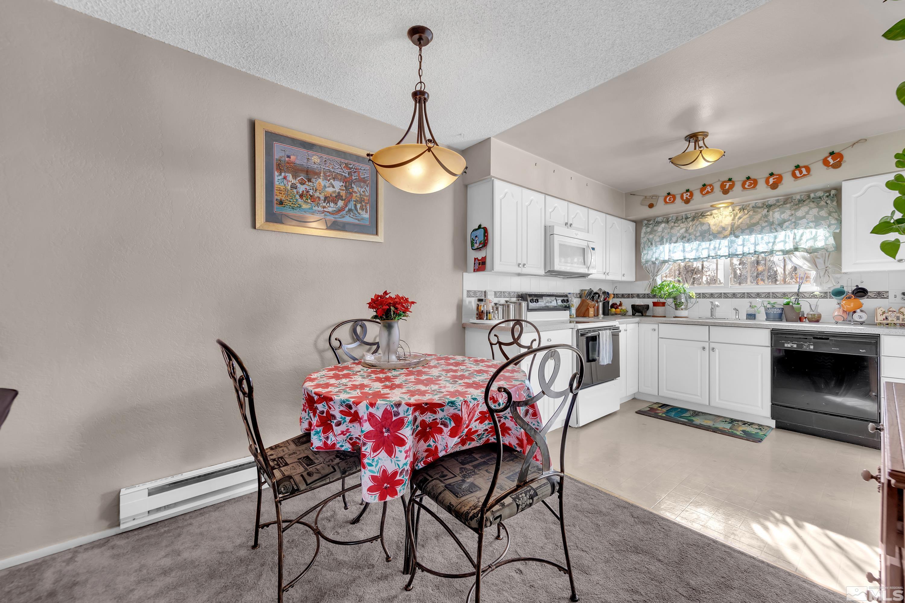 335 Smithridge Park Reno, NV 89502 - Photo 7 of 30 a dining room with furniture and kitchen view