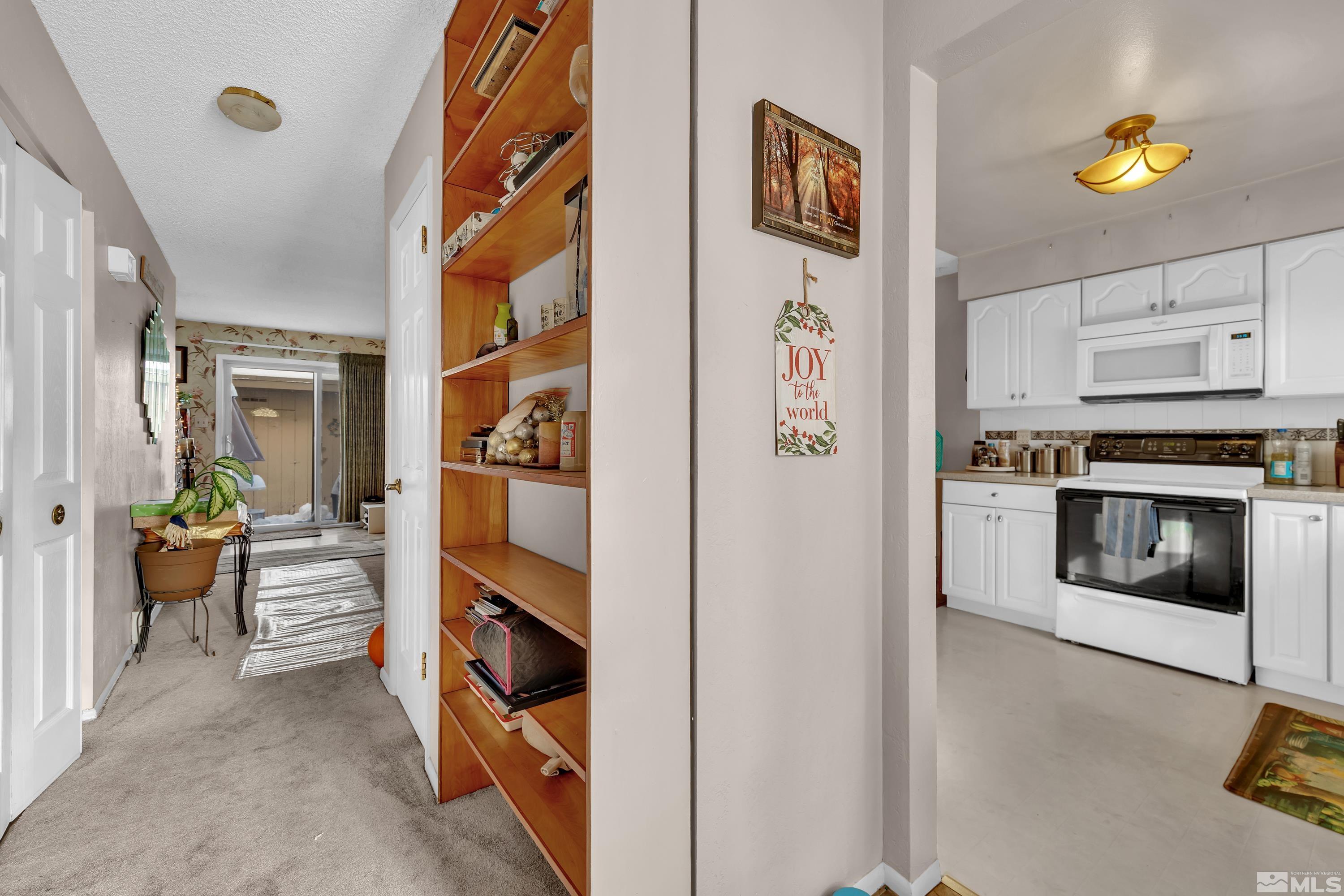 335 Smithridge Park Reno, NV 89502 - Photo 9 of 30 a kitchen with stainless steel appliances granite countertop a refrigerator and a stove