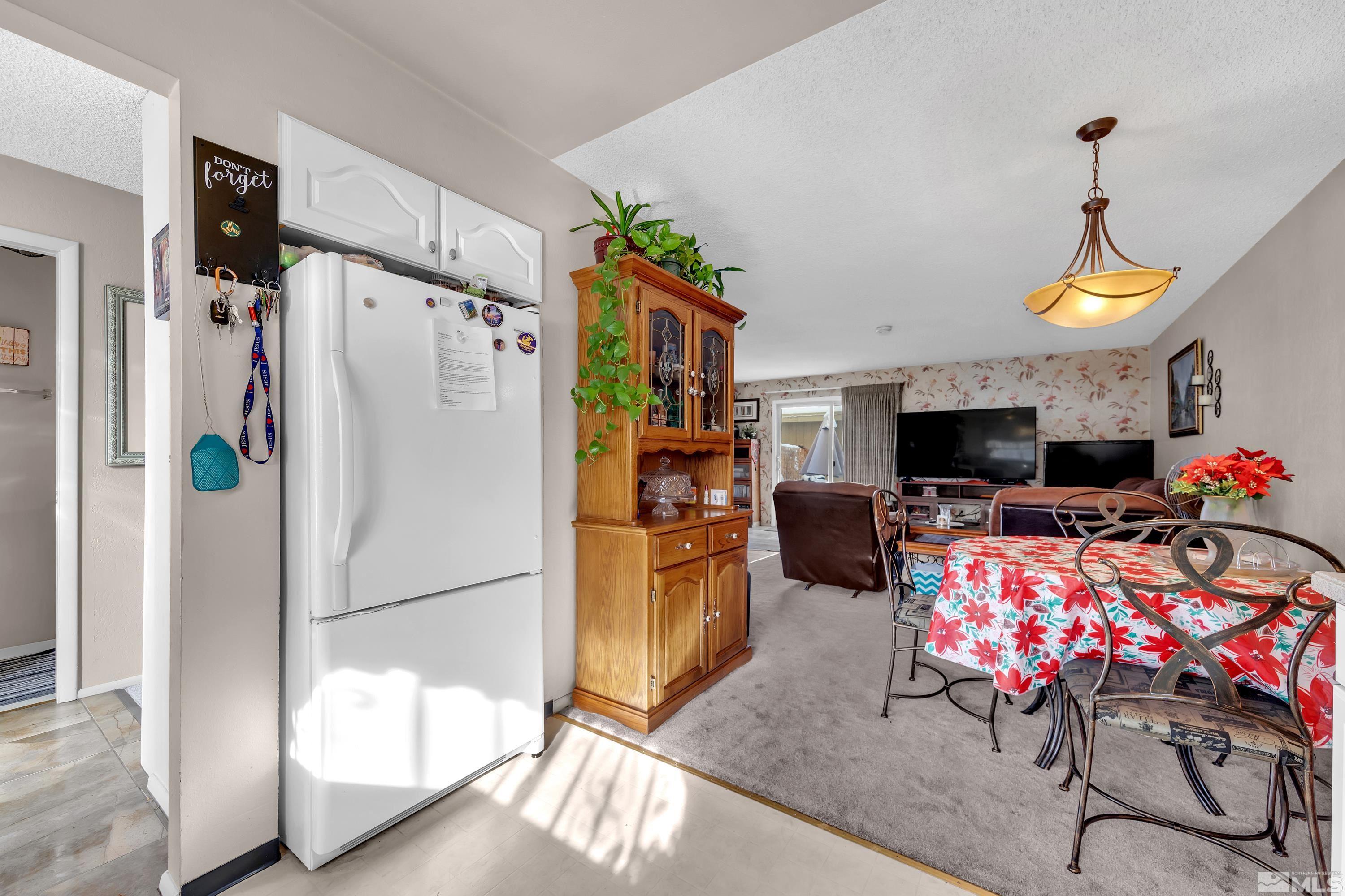 335 Smithridge Park Reno, NV 89502 - Photo 10 of 30 a living room with furniture and a flat screen tv