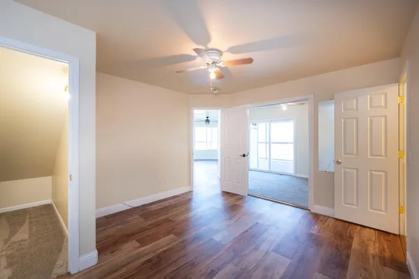 a view of room with wooden floor