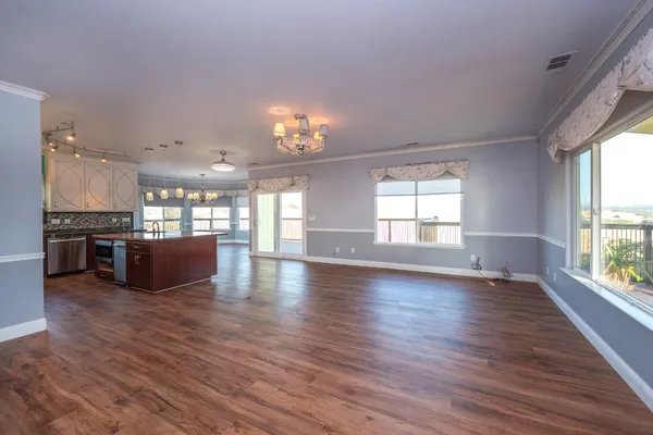 a kitchen with granite countertop a stove top oven and sink