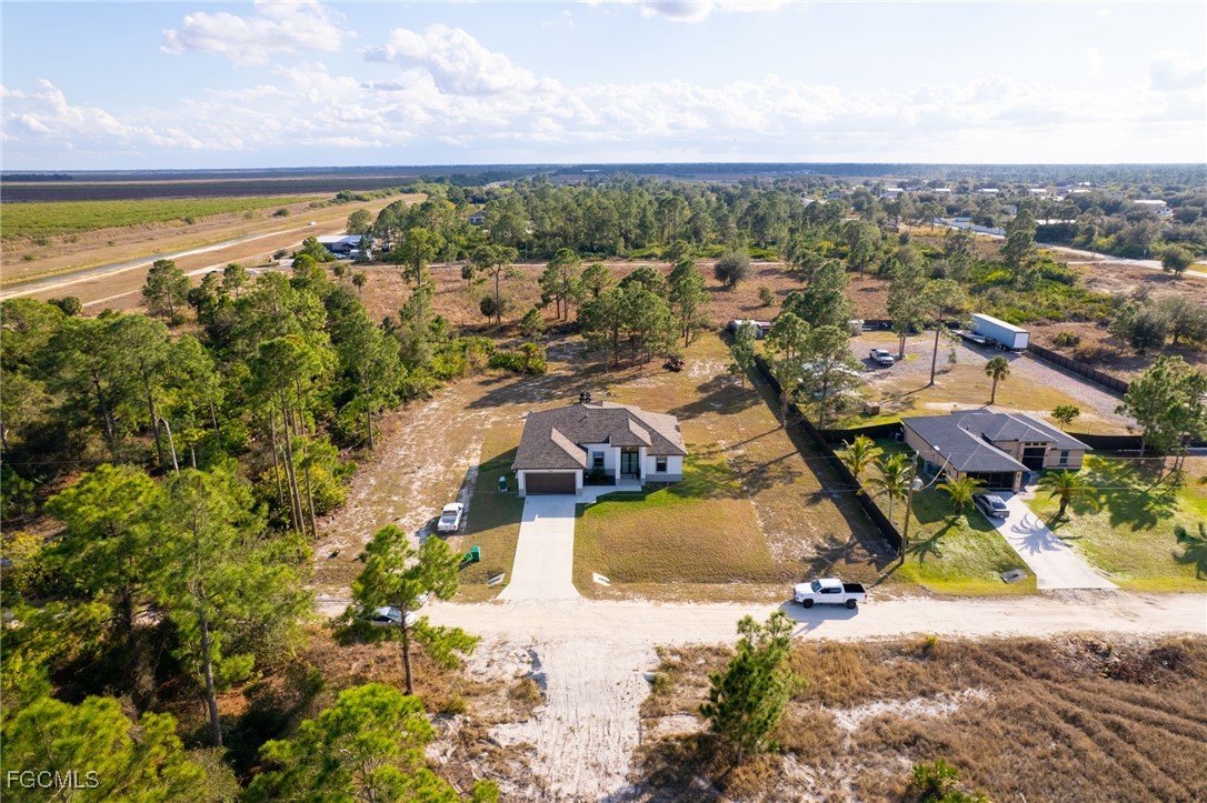 7583 15th Place LaBelle, FL 33935 - Photo 12 of 34 an aerial view of residential houses with outdoor space