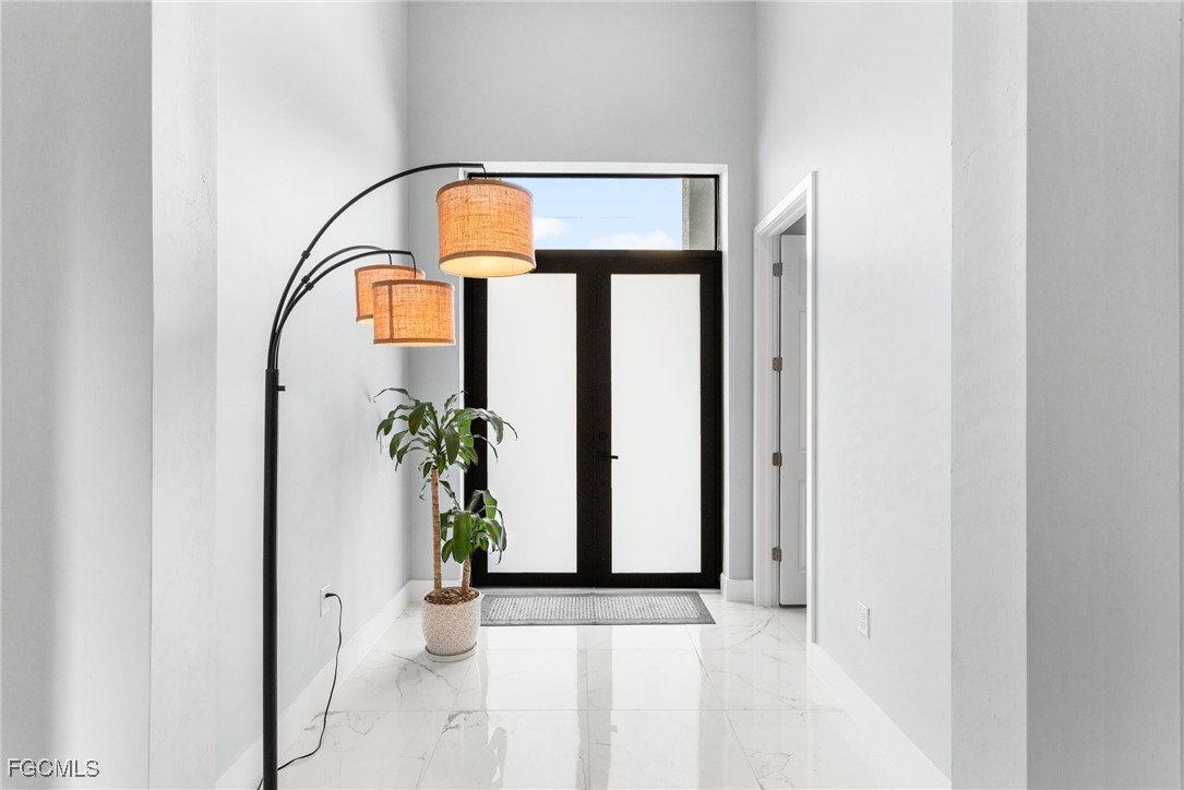 7583 15th Place LaBelle, FL 33935 - Photo 13 of 34 a view of an entryway with wooden floor