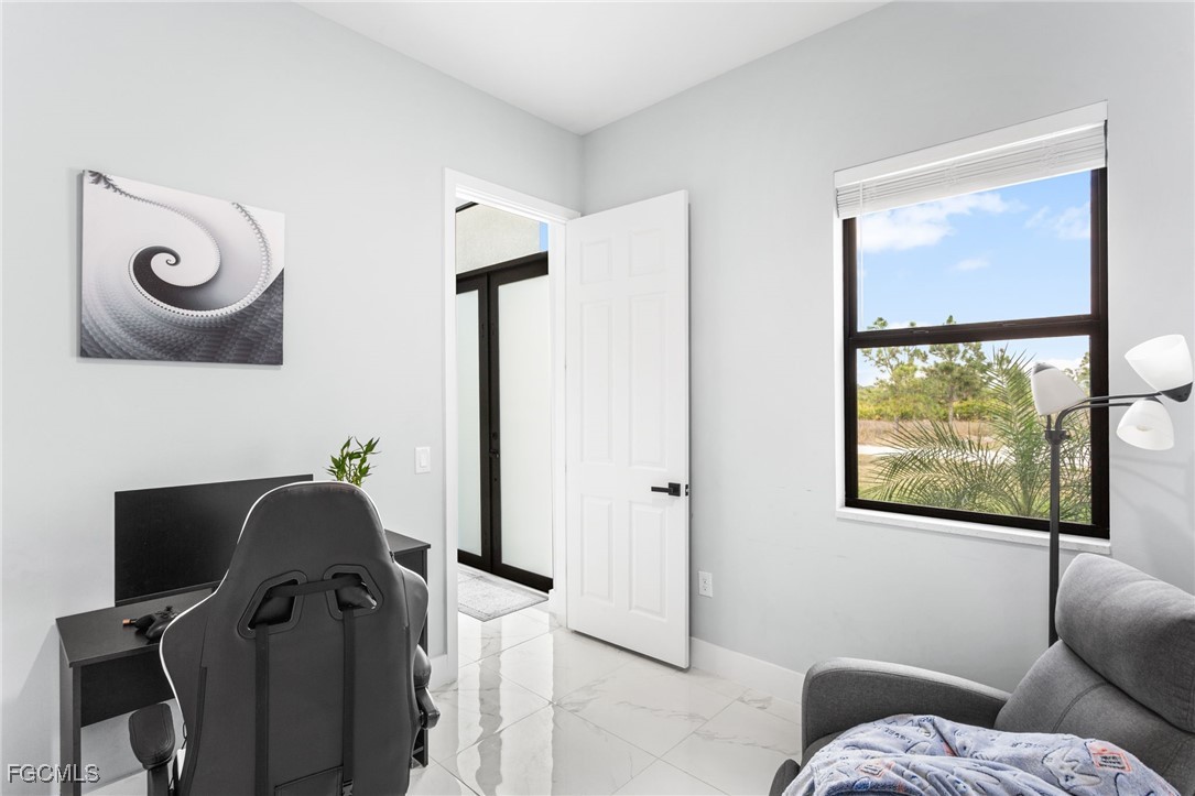 7583 15th Place LaBelle, FL 33935 - Photo 14 of 34 a living room with furniture and a window