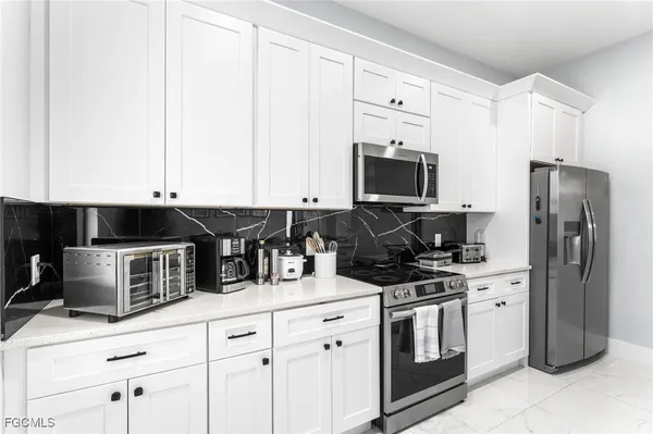 a bedroom with a bed lamp and window