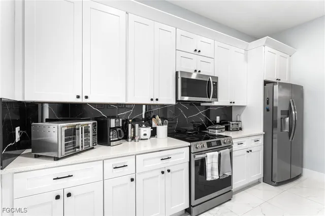 a bedroom with a bed lamp and window