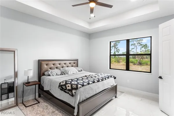 a bedroom with a bed and a couch