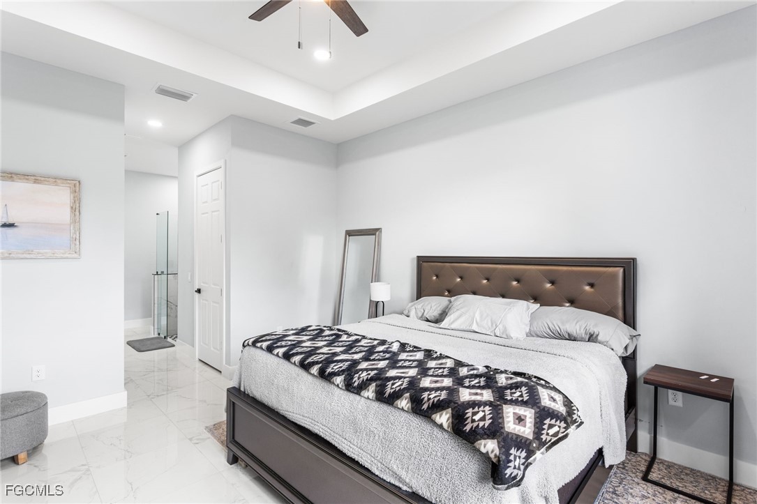 7583 15th Place LaBelle, FL 33935 - Photo 23 of 34 a bedroom with a bed and a couch