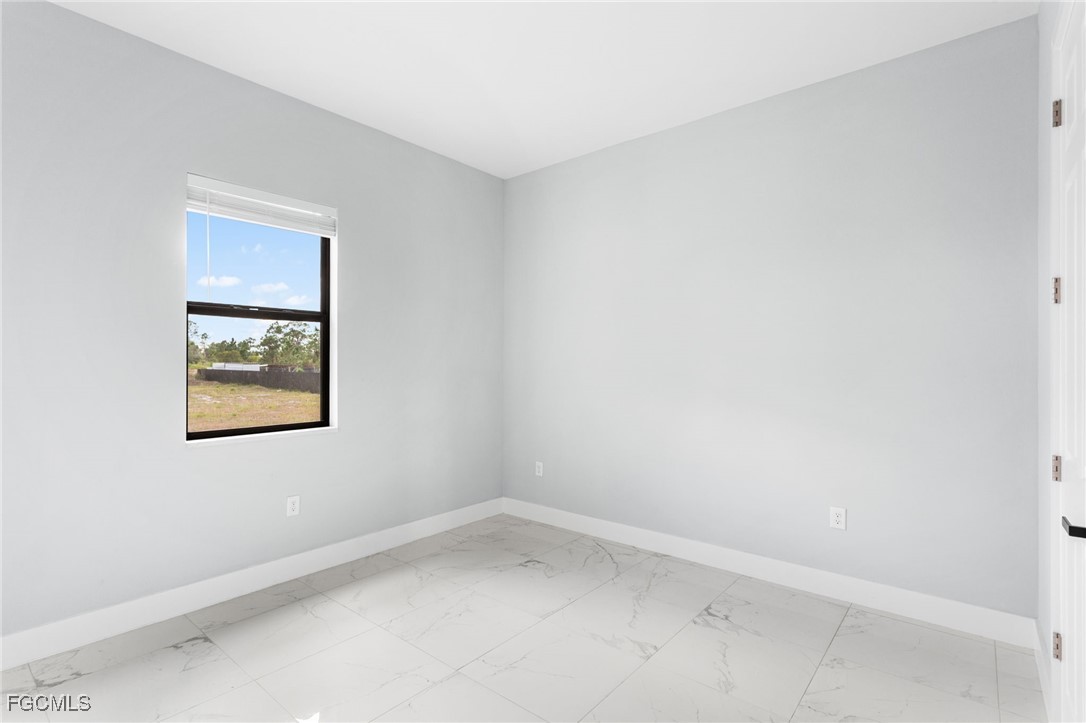 7583 15th Place LaBelle, FL 33935 - Photo 31 of 34 an empty room with a window