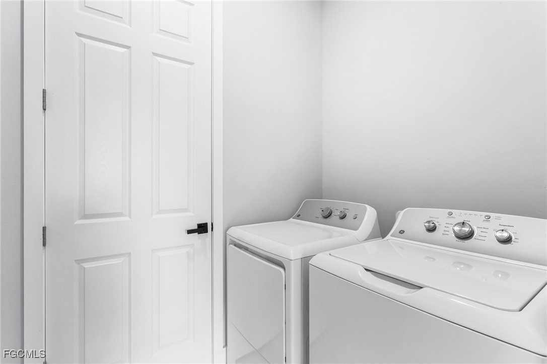 7583 15th Place LaBelle, FL 33935 - Photo 33 of 34 a utility room with dryer and washer