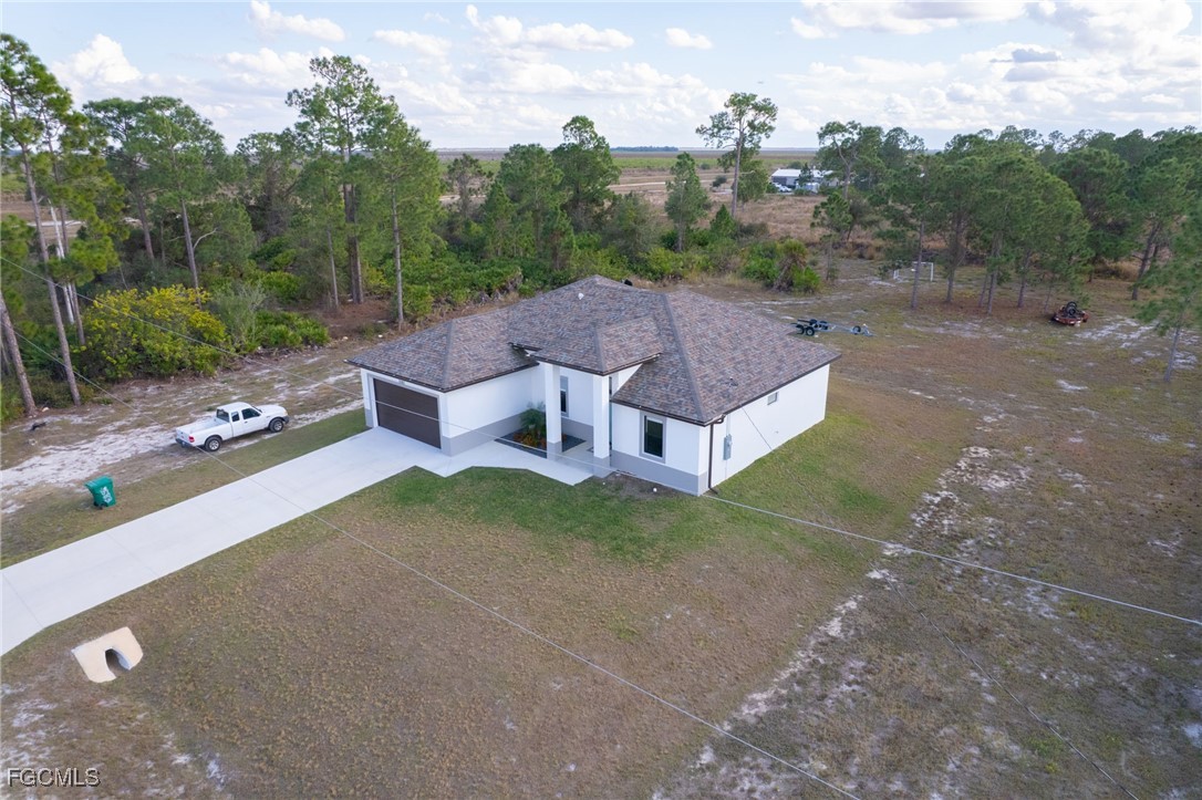 7583 15th Place LaBelle, FL 33935 - Photo 4 of 34 an aerial view of a house with a garden