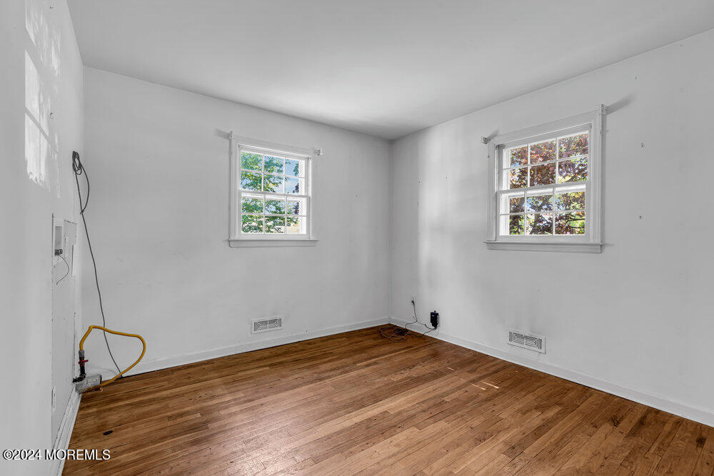 4 Cherry Place Manasquan, NJ 08736 - Photo 24 of 46 a view of a room with wooden floor and window