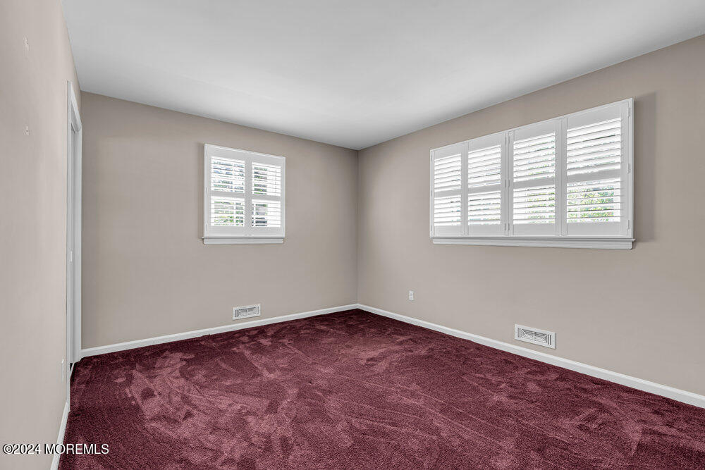 4 Cherry Place Manasquan, NJ 08736 - Photo 27 of 46 a view of an empty room with a window