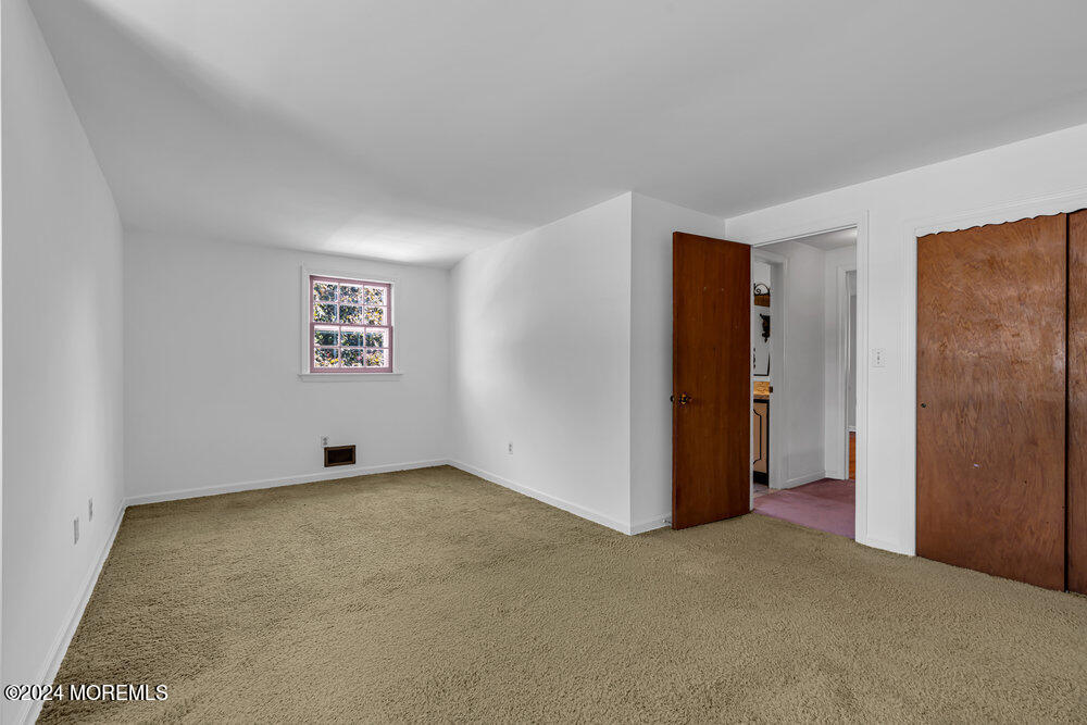 4 Cherry Place Manasquan, NJ 08736 - Photo 31 of 46 a view of an empty room with a window