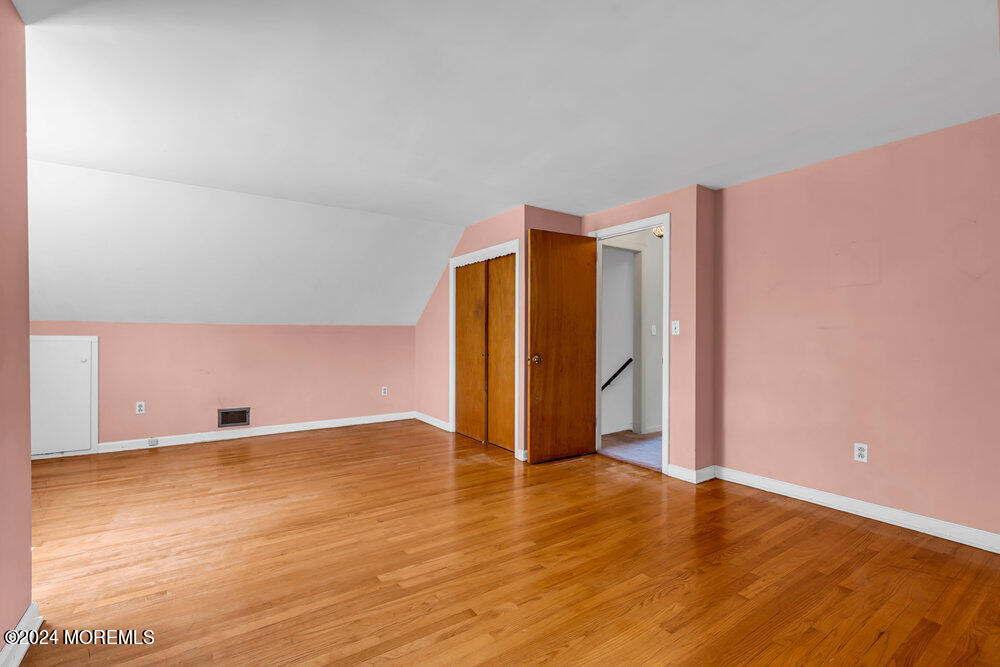 4 Cherry Place Manasquan, NJ 08736 - Photo 34 of 46 a view of an empty room with wooden floor