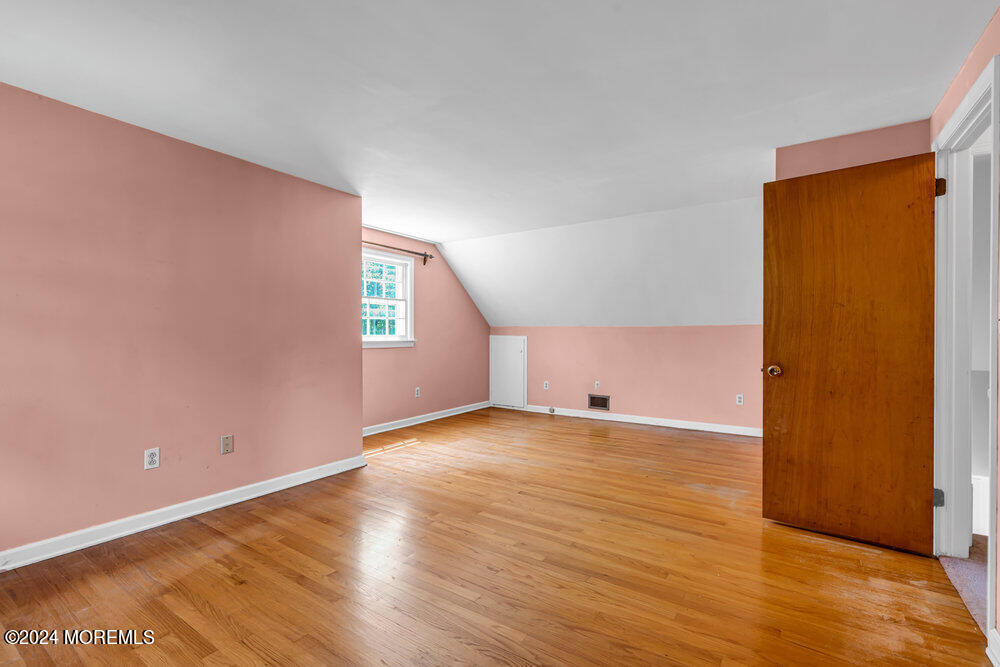 4 Cherry Place Manasquan, NJ 08736 - Photo 35 of 46 a view of empty room with wooden floor
