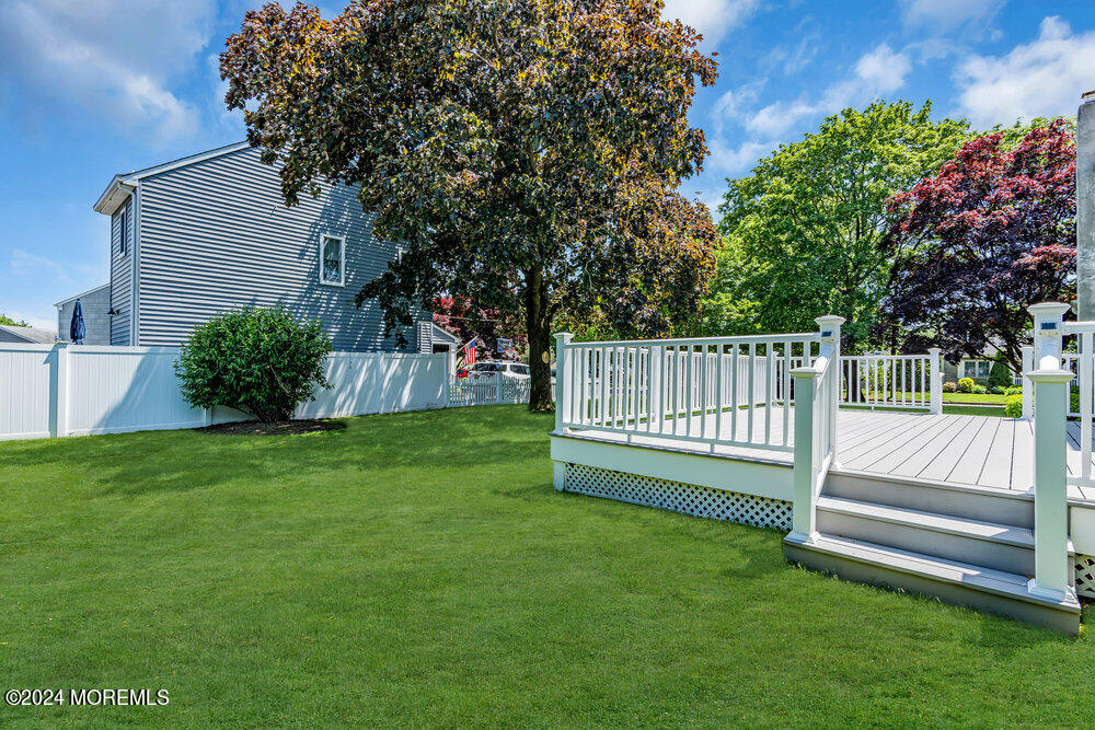 4 Cherry Place Manasquan, NJ 08736 - Photo 7 of 46 a view of a deck with a yard