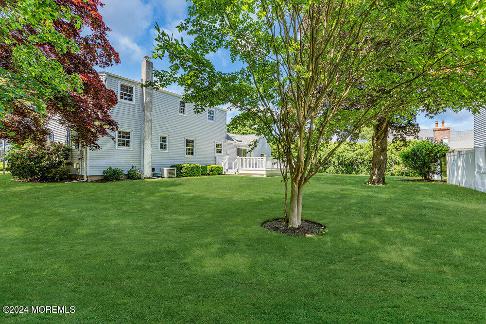 4 Cherry Place Manasquan, NJ 08736 - Photo 9 of 46 a front view of a house with garden
