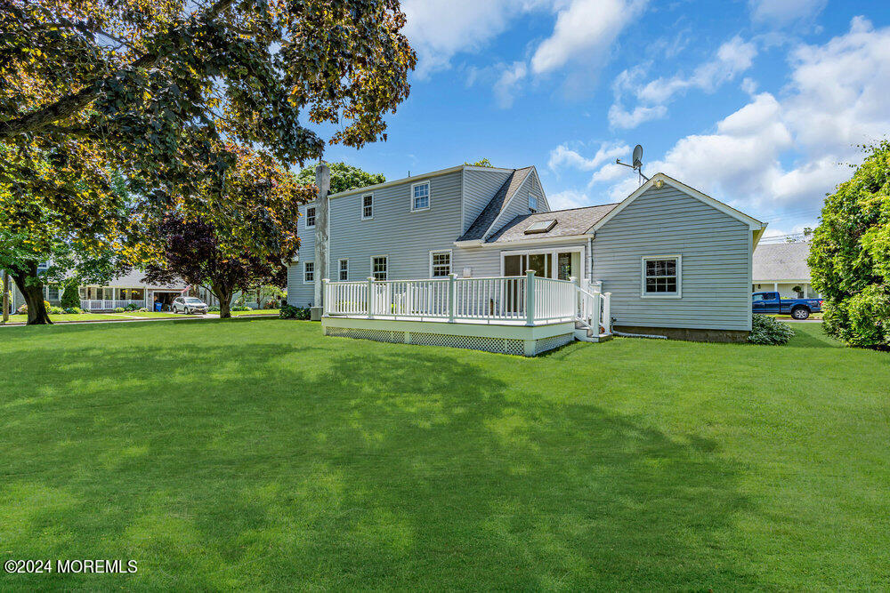 4 Cherry Place Manasquan, NJ 08736 - Photo 10 of 46 a view of a house with a big yard potted plants and large tree