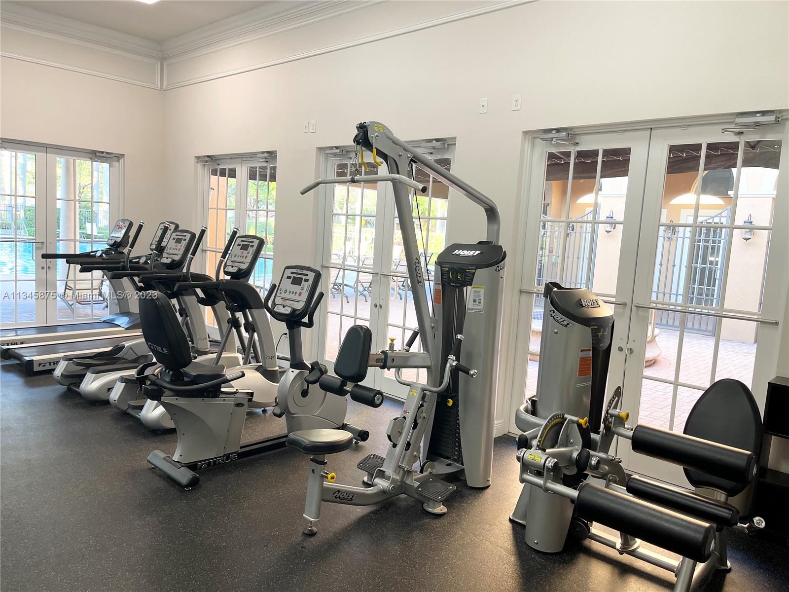 Cobblestone Pembroke Pines, FL 33027 - Photo 12 of 17 a room with gym equipment and windows