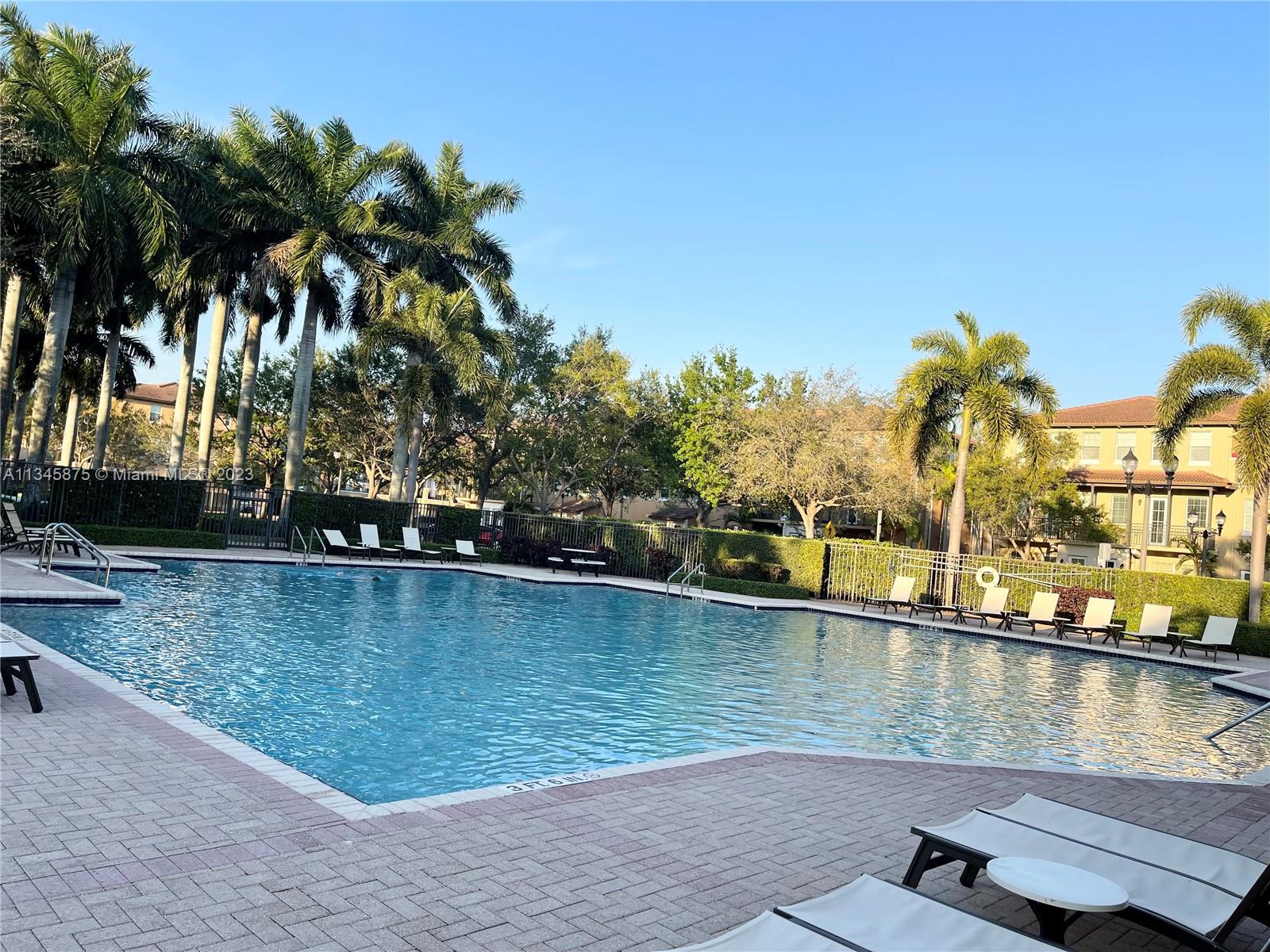 Cobblestone Pembroke Pines, FL 33027 - Photo 14 of 17 a view of a lake with a palm tree