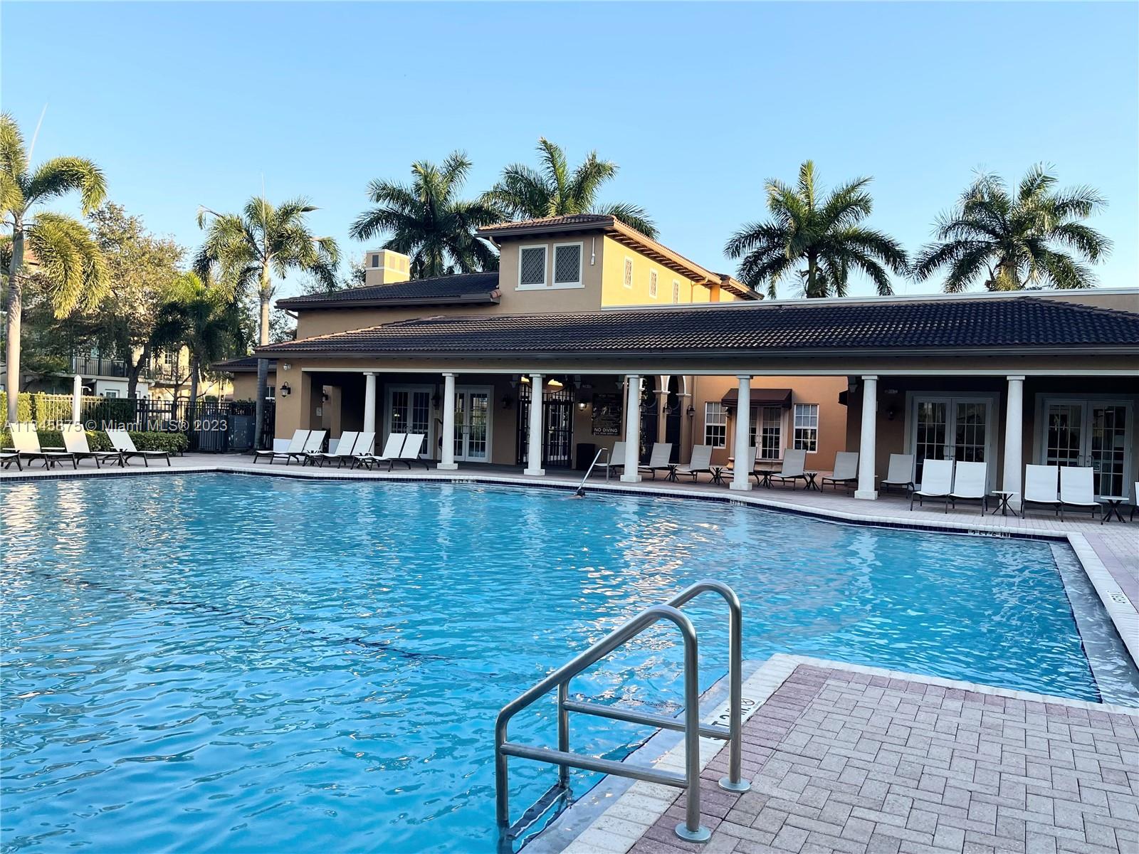 Cobblestone Pembroke Pines, FL 33027 - Photo 15 of 17 a swimming pool with outdoor seating and yard