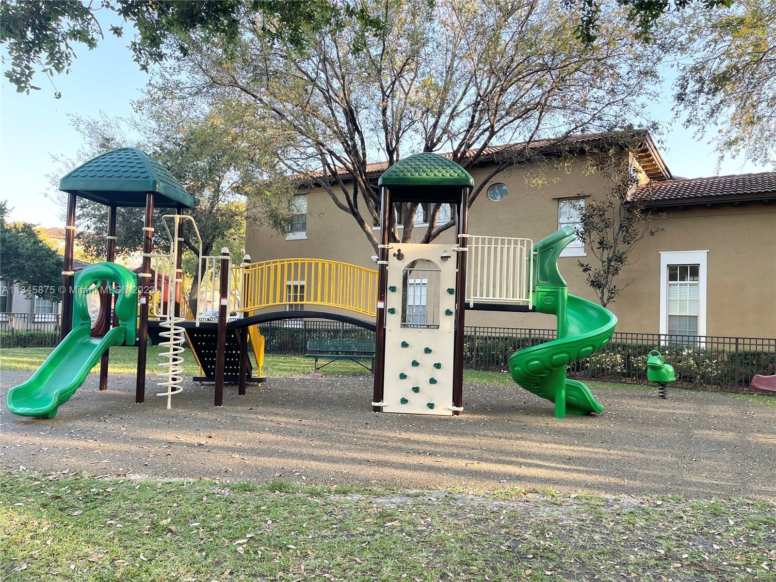 Cobblestone Pembroke Pines, FL 33027 - Photo 10 of 17 a front view of a house with a garden