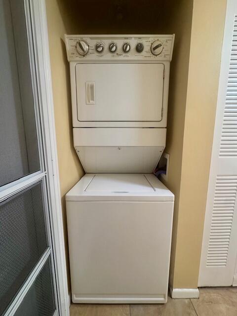 5939 Forest Hill Boulevard, Unit 205 West Palm Beach, FL 33415 - Photo 14 of 19 a utility room with dryer and washer