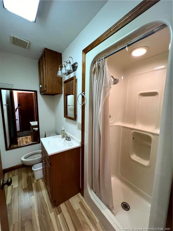 2472-2 John Hall Road Fayetteville, NC 28312 - Photo 7 of 10 a bathroom with a bathtub a mirror and shower