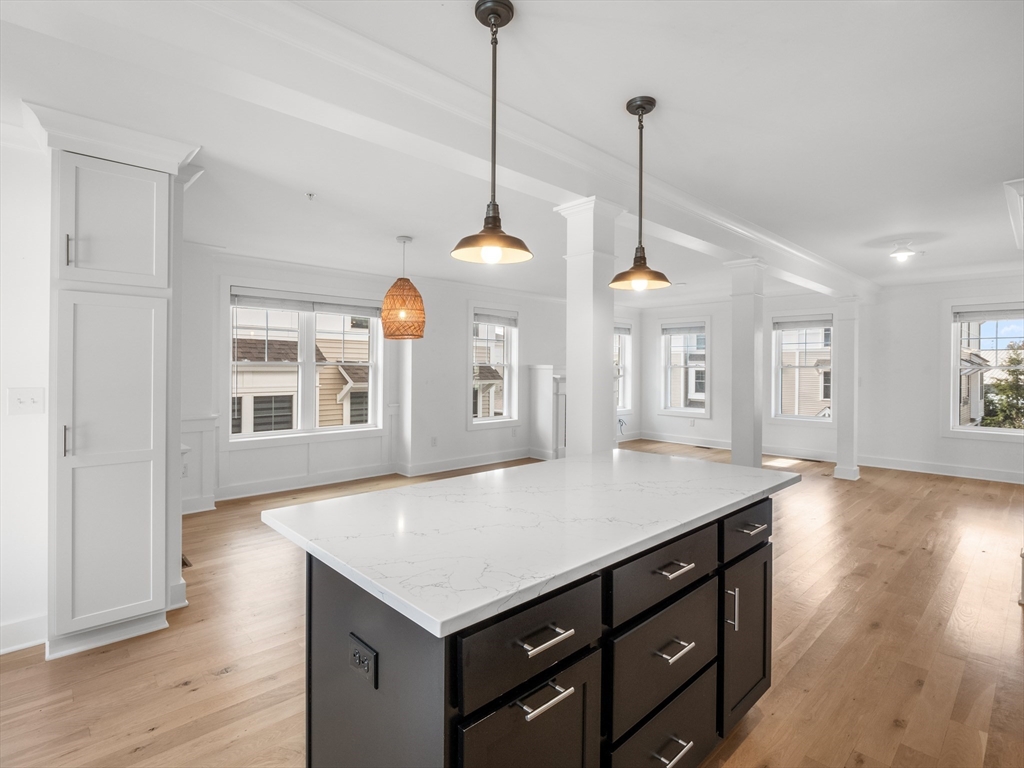 12 Hines, Unit 12 Newburyport, MA 01950 - Photo 16 of 32 a view of a kitchen with a table and chairs