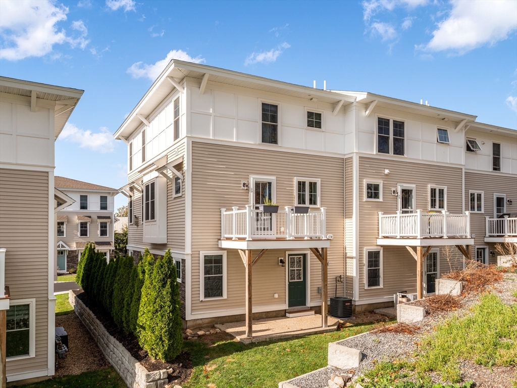 12 Hines, Unit 12 Newburyport, MA 01950 - Photo 2 of 32 a front view of a house with a yard