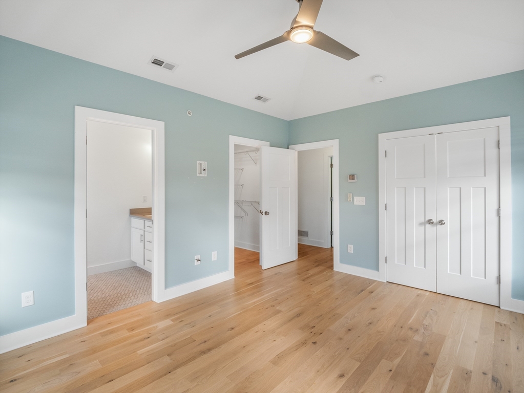 12 Hines, Unit 12 Newburyport, MA 01950 - Photo 25 of 32 a view of empty room with wooden floor