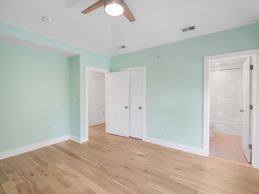 12 Hines, Unit 12 Newburyport, MA 01950 - Photo 31 of 32 a view of an empty room with wooden floor