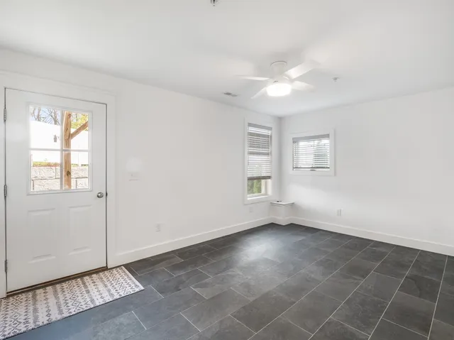 a view of an empty room with a window