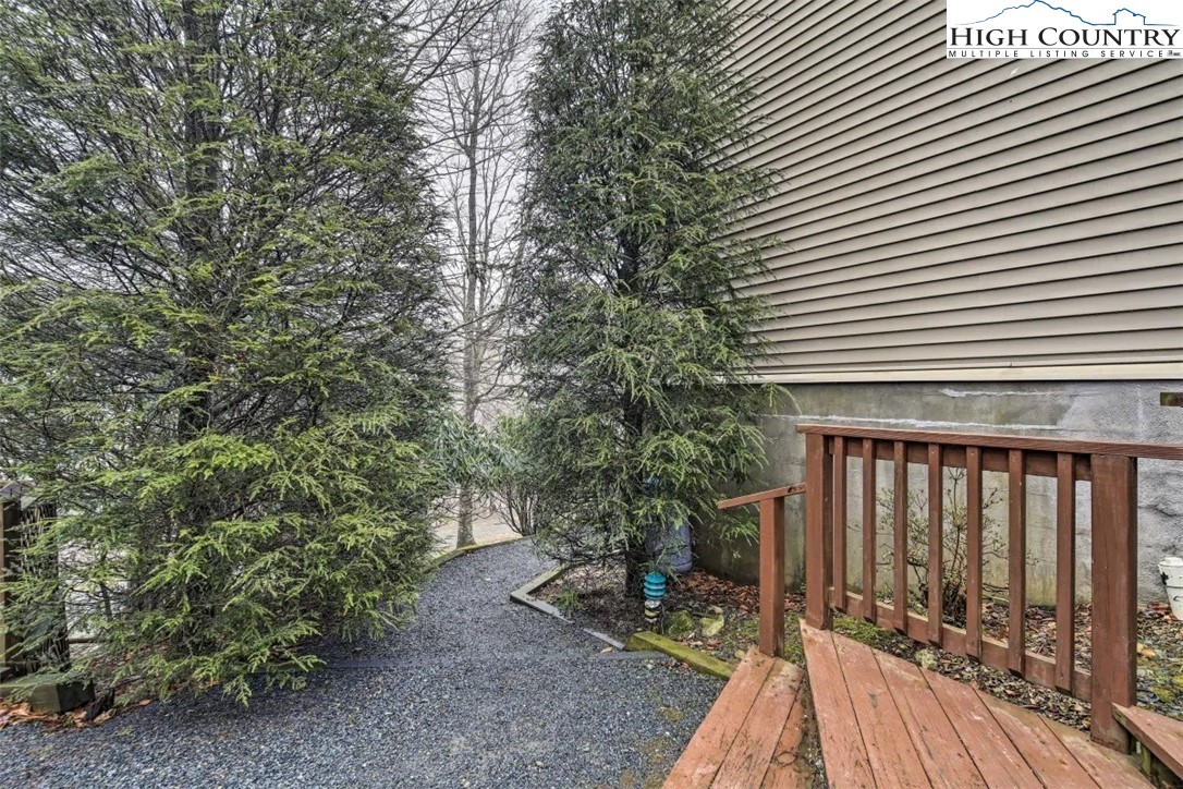 1664 Grouse Moor Drive, Unit 1 Sugar Mountain, NC 28604 - Photo 23 of 27 a view of balcony with wooden floor and fence