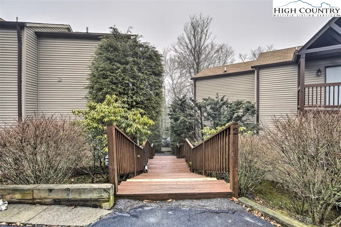 1664 Grouse Moor Drive, Unit 1 Sugar Mountain, NC 28604 - Photo 25 of 27 a view of a pathway of house with wooden fence