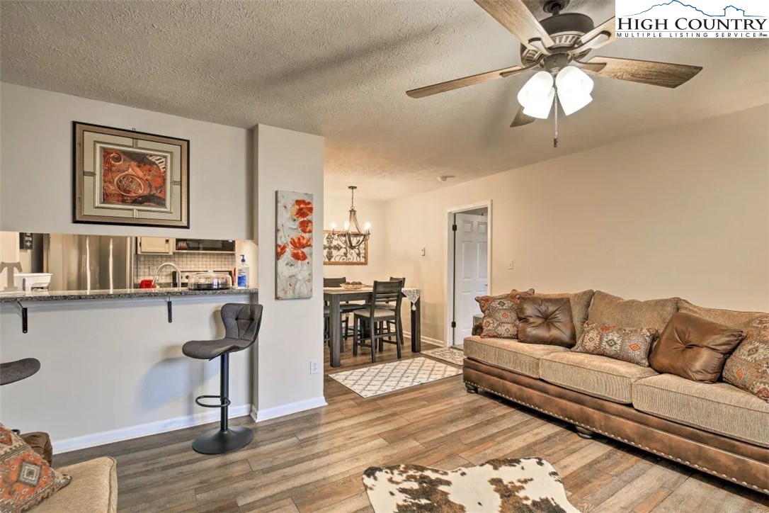1664 Grouse Moor Drive, Unit 1 Sugar Mountain, NC 28604 - Photo 8 of 27 a living room with furniture and wooden floor