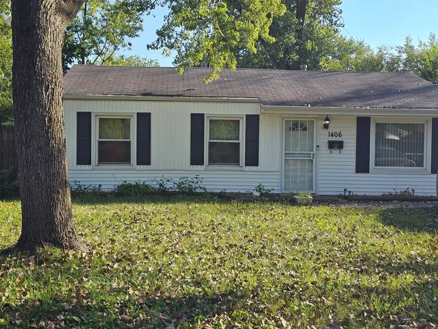 front view of a house with a large window