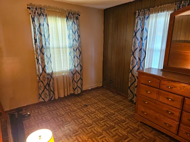 a view of a room with window and stairs