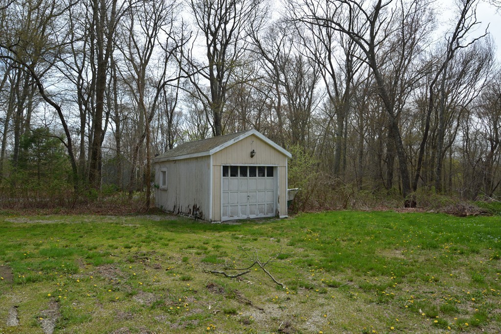 785 Bulgarmarsh Road Tiverton, RI 02878 - Photo 4 of 28 a house with green field in front of it