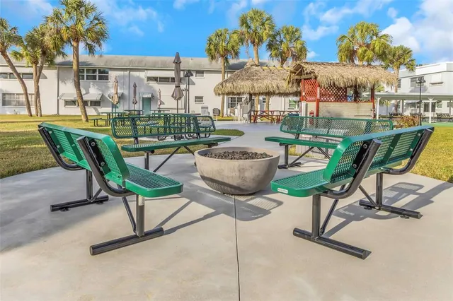 a view of a swimming pool with outdoor seating