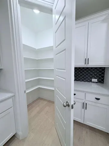 a view of cabinets and window