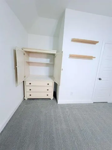 a bathroom with a double vanity sink toilet and shower