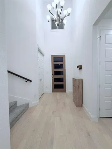 a view of an empty room with a cabinet